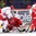 OSTRAVA, CZECH REPUBLIC - MAY 5: Belarus' Alexander Kitarov #77 tries to get the puck past Denmark's Patrick Galbraith #1 with Morten Green #13 in front during preliminary round action at the 2015 IIHF Ice Hockey World Championship. (Photo by Richard Wolowicz/HHOF-IIHF Images)

